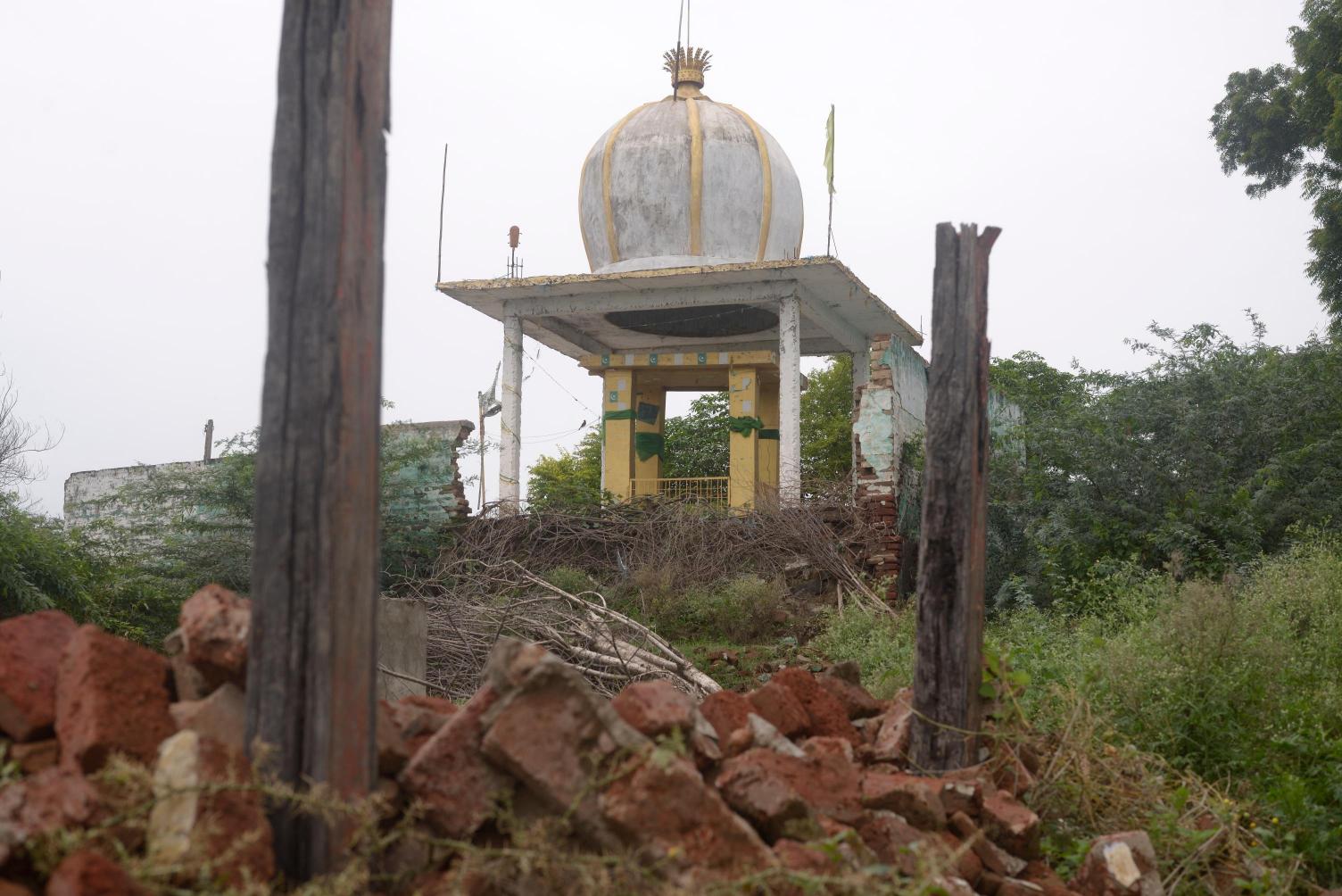 Mazar (mausoleum), in village Chikhalda, Madhya Pradesh, surfaces after its submergence in the Sarovar Dam as the reservoir waters recede, Photo credit_ Rohit Jain for Oral History Narmada
