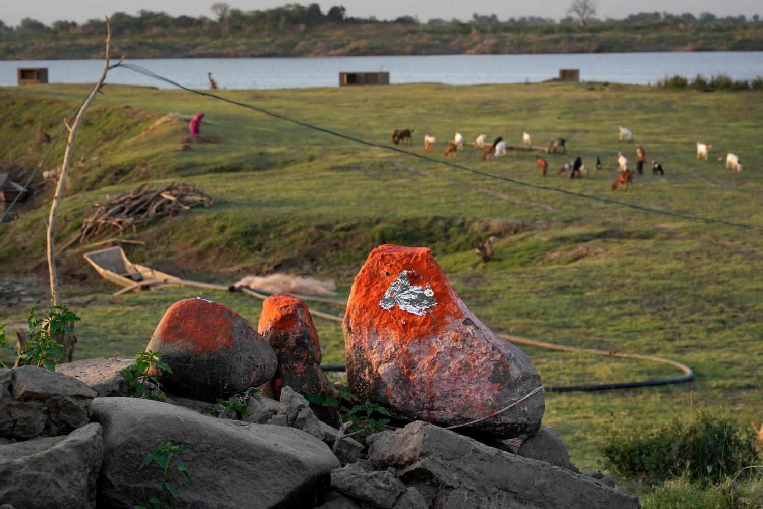 Remnants of the place of worship of Bhilet Baba, a deity worshipped by adivasi community in village Sondul, Madhya Pradesh, as the Sardar Sarovar Dam waters recede in summer, Photo credit_ Rohit Jain for Oral History Narmada