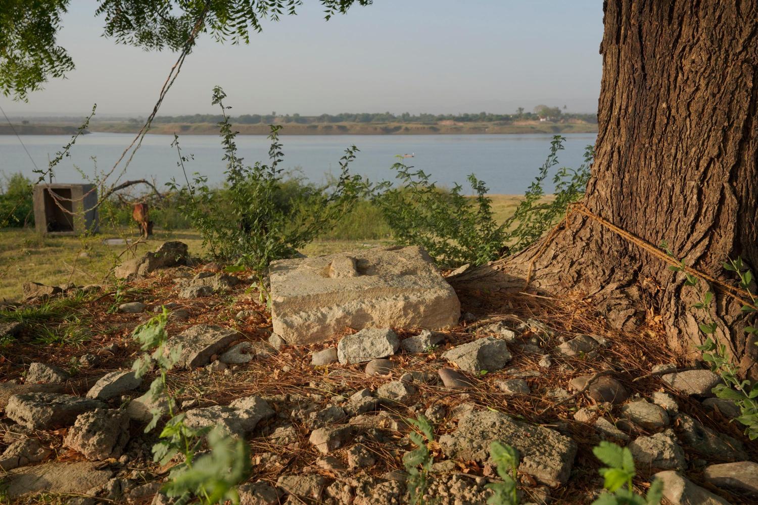 Samadhi of an ascetic_ holy person submerges in the Sardar Sarovar Dam waters in the village Gangli, Madhya Pradesh, and resurfaces when the dam waters recede, Photo credit_ Rohit Jain for Oral History Narmada
